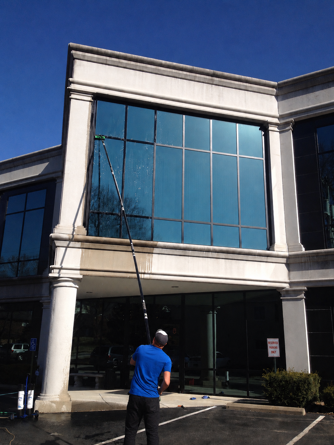 Commercial exterior window cleaning on a two-story office building